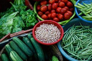 Vibrant assortment of fresh vegetables at a local Vietnamese market.
